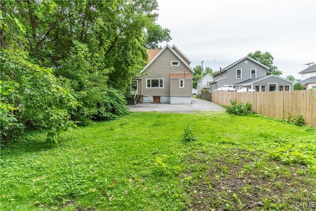 662 Burchard St, Watertown City, NY 13601 - back of house featuring a patio area