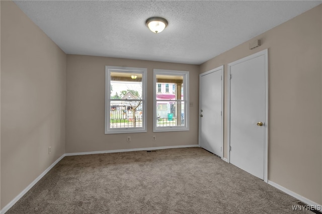 74 Bush St, Buffalo, NY 14207 - unfurnished bedroom featuring carpet and a textured ceiling