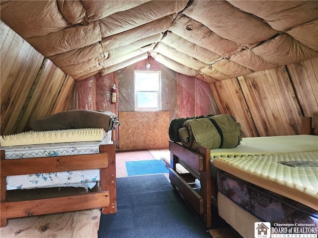 8805 Chautauqua Rd, Pomfret, NY 14063 - carpeted bedroom featuring lofted ceiling and wooden walls