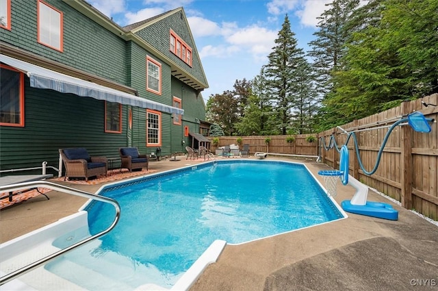 4 Jewett Pl, Utica, NY 13501 - view of pool featuring a patio area, a fenced backyard, and a diving board