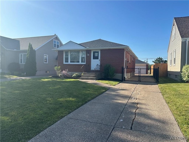 207 Waverly Ave, Tonawanda, NY 14217 - view of front of house with a gate, brick siding, and roof with shingles