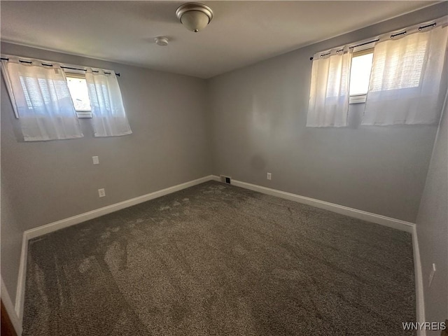 207 Waverly Ave, Tonawanda, NY 14217 - spare room with healthy amount of natural light and dark colored carpet
