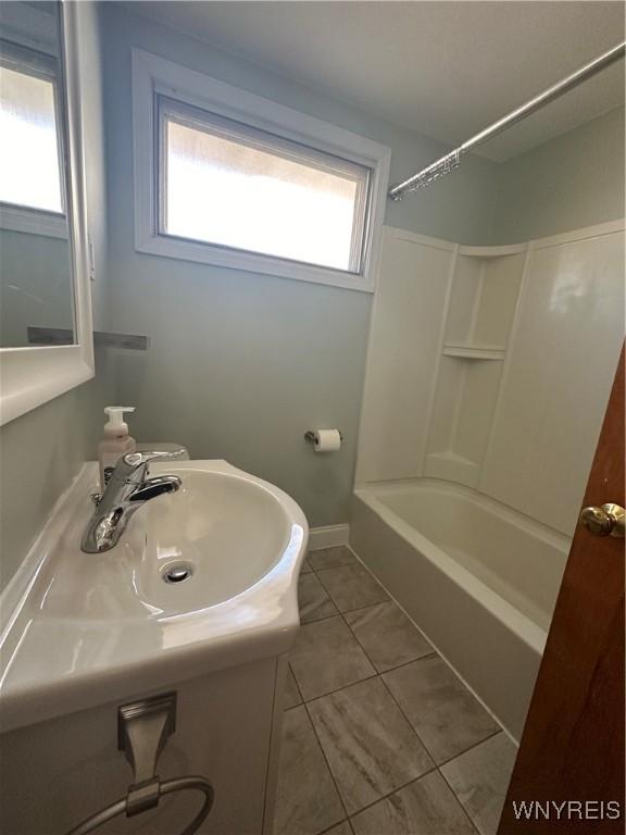 207 Waverly Ave, Tonawanda, NY 14217 - full bath with tile patterned floors and  shower combination