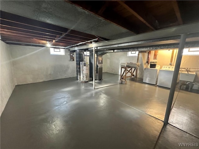 207 Waverly Ave, Tonawanda, NY 14217 - basement featuring washer and dryer, water heater, and heating unit