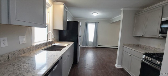 429 S Hamilton St, Watertown City, NY 13601 - kitchen with stainless steel range with gas stovetop, a baseboard radiator, dark wood-style flooring, ornamental molding, and light stone countertops