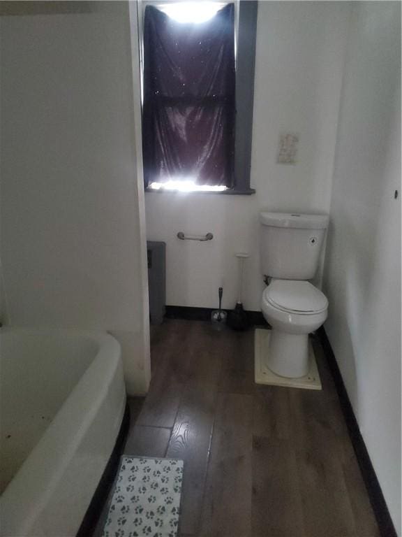 285 Magee Ave, Rochester, NY 14613 - full bathroom with wood finished floors and a bath