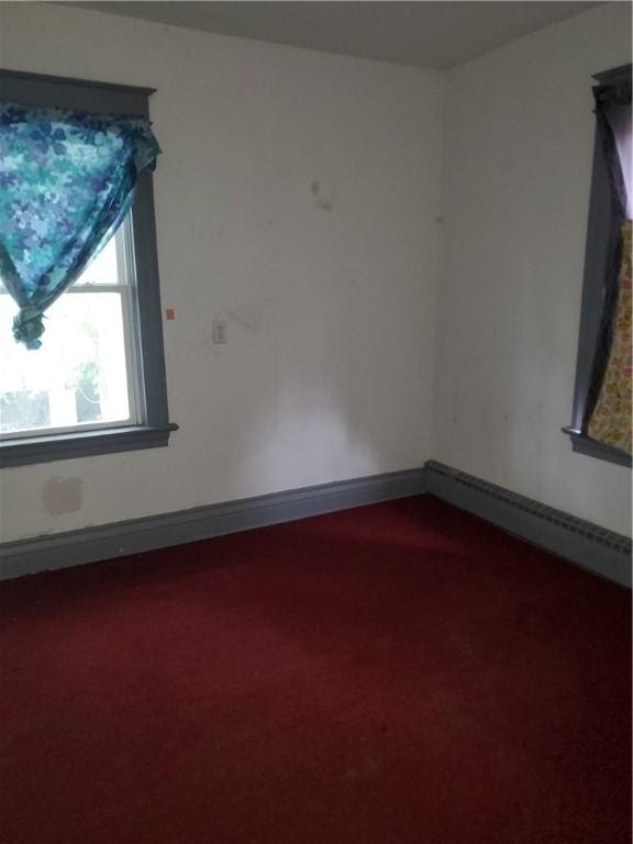 285 Magee Ave, Rochester, NY 14613 - spare room featuring carpet floors and a baseboard radiator