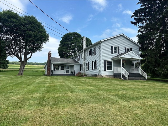 8557 Reeds Corners Rd, Sparta, NY 14437 - view of front of property with a chimney, a front yard, and covered porch
