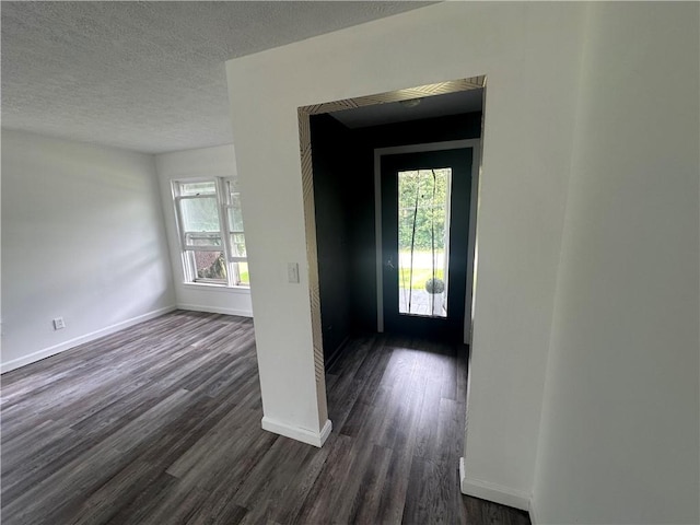 8557 Reeds Corners Rd, Sparta, NY 14437 - foyer featuring dark wood-style floors and a textured ceiling