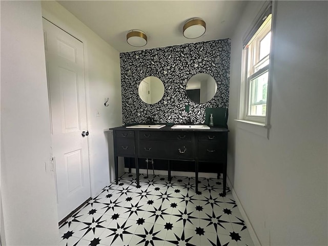 8557 Reeds Corners Rd, Sparta, NY 14437 - full bathroom with an accent wall, tile patterned floors, wallpapered walls, and double vanity