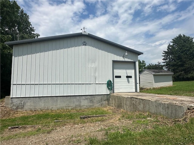 8557 Reeds Corners Rd, Sparta, NY 14437 - view of home's exterior featuring an outdoor structure and a detached garage