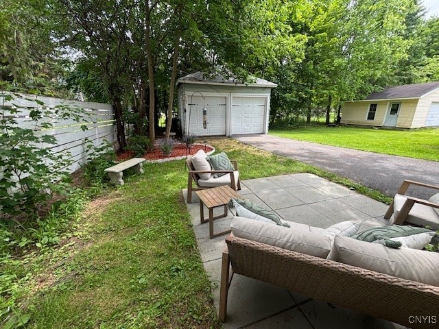 1 Mcbride St, Kirkland, NY 13323 - view of yard featuring an outdoor structure, a detached garage, and an outdoor living space
