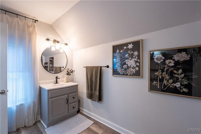 1 Mcbride St, Kirkland, NY 13323 - bathroom featuring vanity, wood finished floors, and lofted ceiling