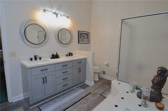 122 Thorn Apple Ln, Greece, NY 14626 - full bathroom featuring double vanity and wood finished floors