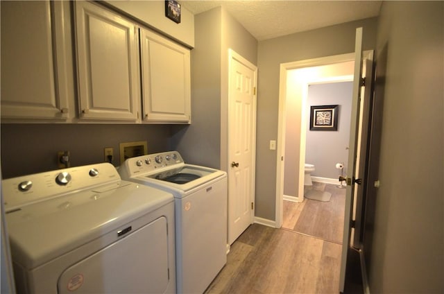 122 Thorn Apple Ln, Greece, NY 14626 - laundry area featuring cabinet space, washer and clothes dryer, and dark wood-style floors