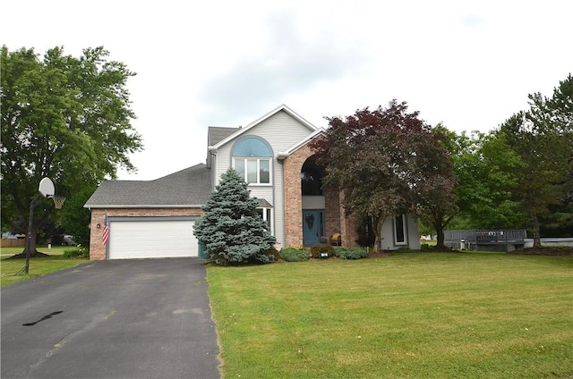 122 Thorn Apple Ln, Greece, NY 14626 - view of front of home with brick siding, driveway, a front lawn, and an attached garage