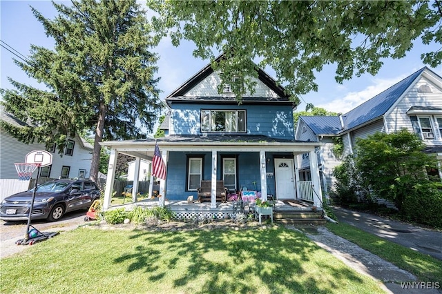 13 Highland Pl, Lancaster, NY 14086 - american foursquare style home with covered porch and a front lawn