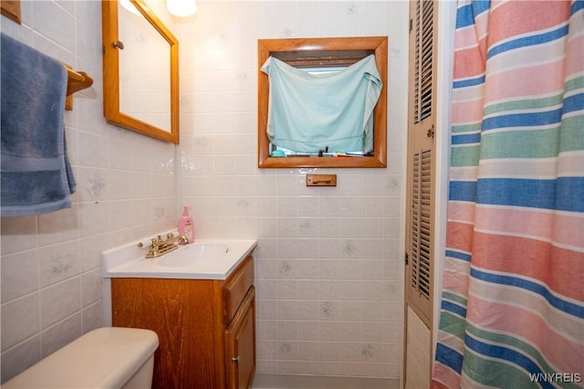 13 Highland Pl, Lancaster, NY 14086 - bathroom featuring tile walls, vanity, and a shower with curtain