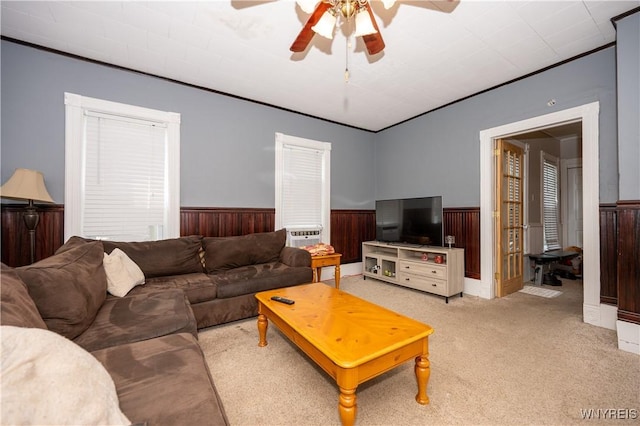 13 Highland Pl, Lancaster, NY 14086 - carpeted living area featuring wainscoting, ceiling fan, and wood walls