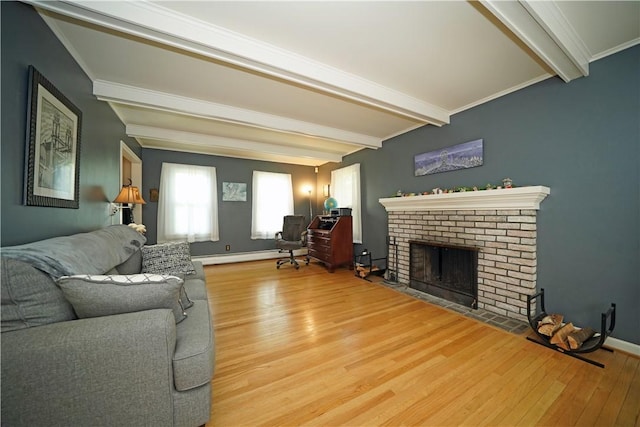 164 Coleman Ave, Elmira, NY 14903 - living area with beamed ceiling, wood finished floors, a fireplace, and a baseboard heating unit