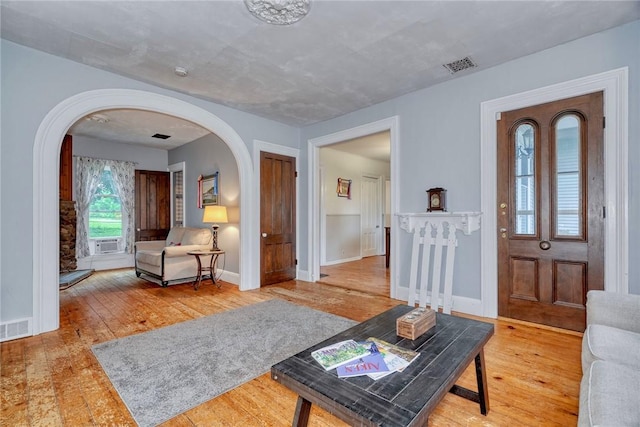 2360 Harris Rd, Palmyra, NY 14522 - living room featuring arched walkways and hardwood / wood-style flooring
