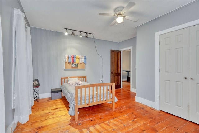 2360 Harris Rd, Palmyra, NY 14522 - bedroom featuring hardwood / wood-style floors, ceiling fan, and a closet