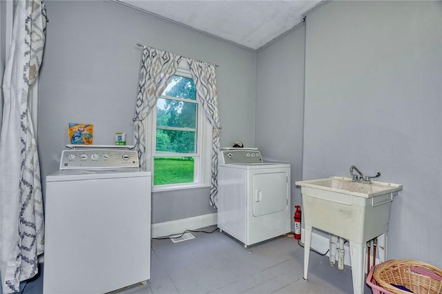 2360 Harris Rd, Palmyra, NY 14522 - laundry room with washer and clothes dryer, healthy amount of natural light, and crown molding