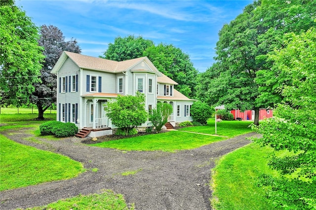 2360 Harris Rd, Palmyra, NY 14522 - view of front of property featuring a front lawn and view of wooded area
