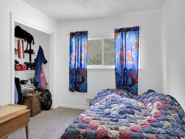 449 Pinnacle Rd, Henrietta, NY 14623 - carpeted bedroom featuring a closet and a textured ceiling