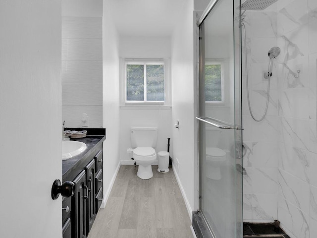 449 Pinnacle Rd, Henrietta, NY 14623 - bathroom featuring a marble finish shower, vanity, and wood finished floors