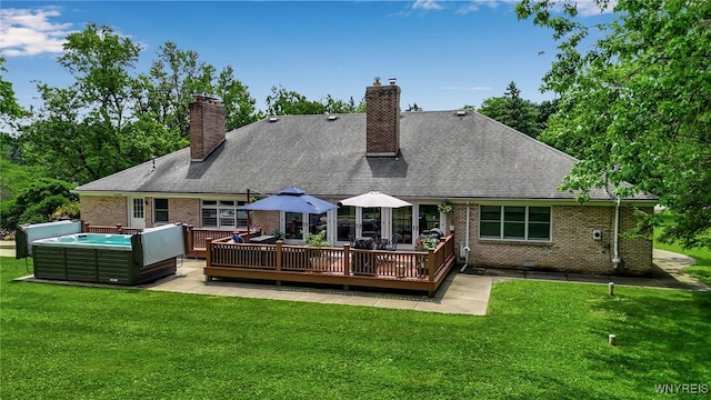 4901 Pineledge Dr W, Clarence, NY 14031 - back of property with brick siding, a wooden deck, a chimney, and a yard