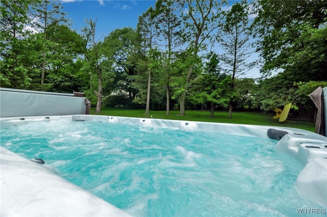 4901 Pineledge Dr W, Clarence, NY 14031 - view of pool with a yard, view of wooded area, and a playground