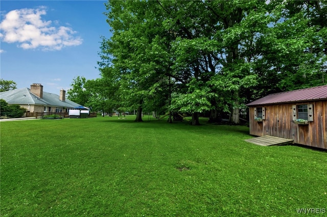 4901 Pineledge Dr W, Clarence, NY 14031 - view of grassy yard with a shed