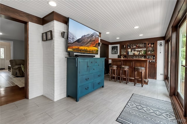 4901 Pineledge Dr W, Clarence, NY 14031 - indoor dry bar with wooden ceiling, brick wall, and recessed lighting