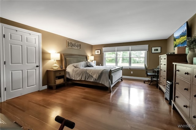 4901 Pineledge Dr W, Clarence, NY 14031 - bedroom featuring dark wood-style floors and baseboards