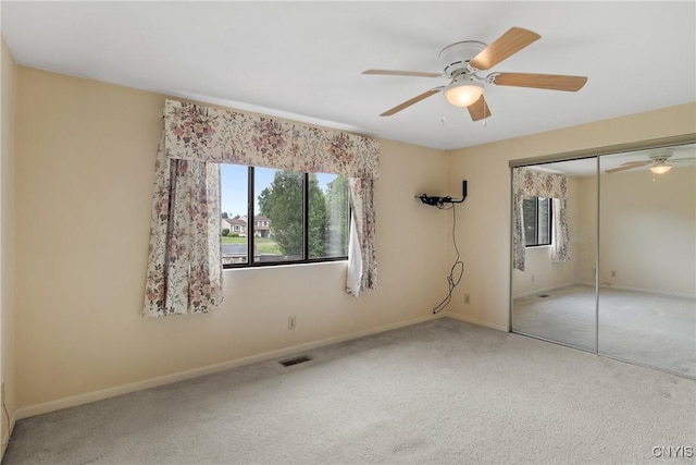 8493 Bubbling Springs Dr, Clay, NY 13027 - unfurnished bedroom with carpet, a closet, and ceiling fan
