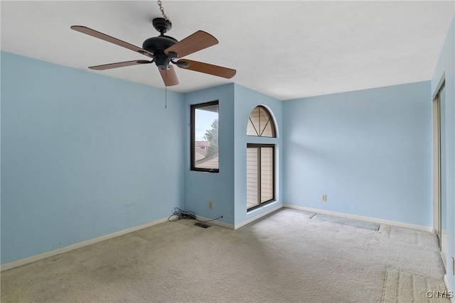 8493 Bubbling Springs Dr, Clay, NY 13027 - carpeted spare room featuring a ceiling fan and baseboards