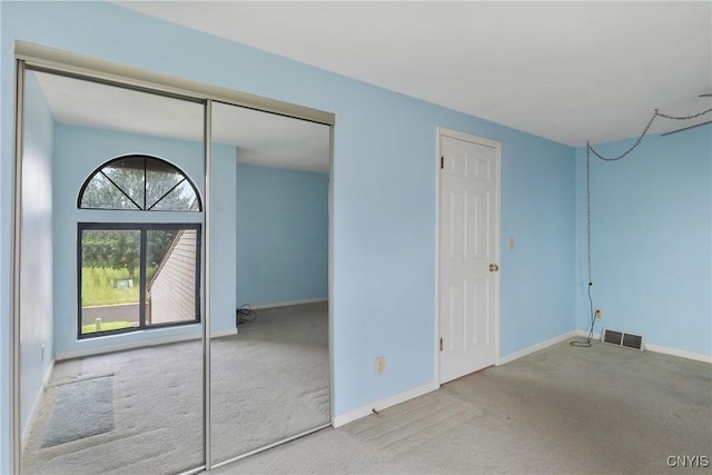 8493 Bubbling Springs Dr, Clay, NY 13027 - unfurnished bedroom featuring carpet and a closet
