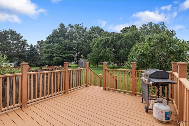 8493 Bubbling Springs Dr, Clay, NY 13027 - deck featuring a storage unit, a grill, and view of wooded area