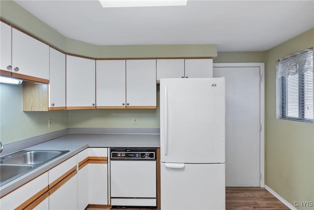 8493 Bubbling Springs Dr, Clay, NY 13027 - kitchen with white appliances, white cabinets, wood finished floors, and light countertops