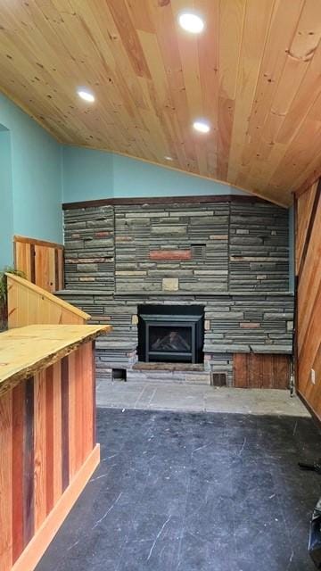 27 Watson Farm Rd, Summit, PA 16720 - unfurnished living room featuring vaulted ceiling, a fireplace, recessed lighting, and wood walls