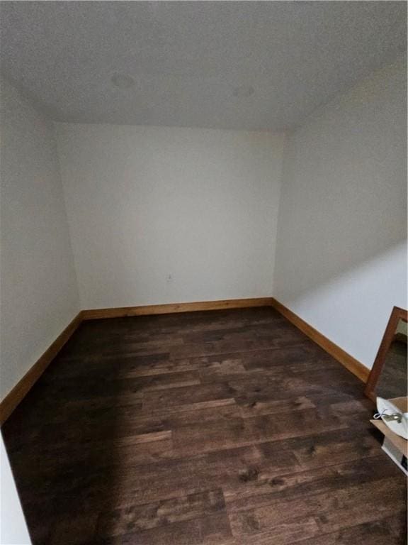 27 Watson Farm Rd, Summit, PA 16720 - empty room with dark wood-style floors and baseboards