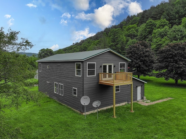 27 Watson Farm Rd, Summit, PA 16720 - back of house with a view of trees, a lawn, and a balcony