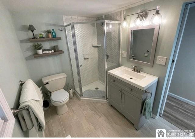 3 Mapleview Ave, Busti, NY 14750 - bathroom with wood finished floors, vanity, and a shower stall
