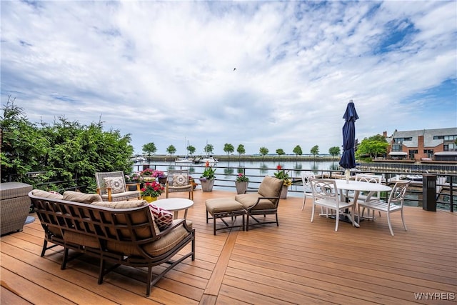 176 Rivermist Dr, Buffalo, NY 14202 - wooden terrace with outdoor dining space and a water view