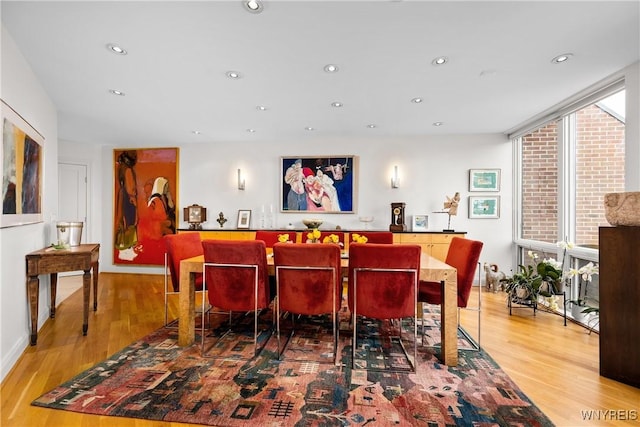 176 Rivermist Dr, Buffalo, NY 14202 - dining area with healthy amount of natural light, wood finished floors, expansive windows, and recessed lighting