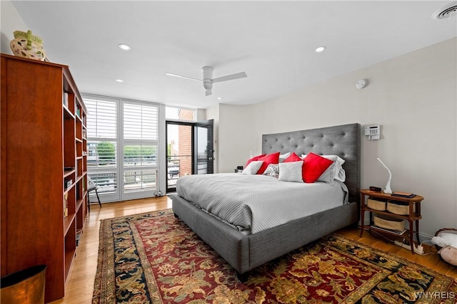 176 Rivermist Dr, Buffalo, NY 14202 - bedroom featuring access to exterior, light wood finished floors, a wall of windows, a ceiling fan, and recessed lighting