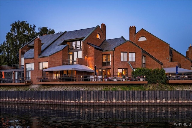 176 Rivermist Dr, Buffalo, NY 14202 - rear view of house with brick siding and a water view