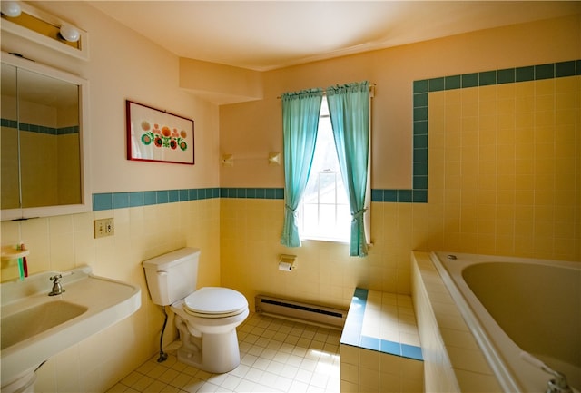 2943 Thompson Hollow Rd, Middletown, NY 12455 - full bathroom featuring a baseboard heating unit, tile patterned floors, tile walls, a relaxing tiled tub, and a wainscoted wall
