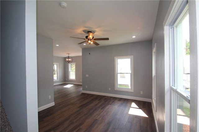38 Spring St, Sweden, NY 14420 - empty room featuring dark wood-style floors, a ceiling fan, recessed lighting, a smoke detector, and a chandelier